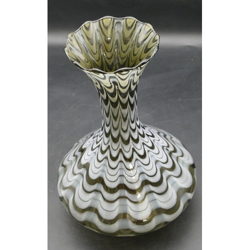 84 - A Loetz round bulbous thin necked trumpet shaped glass vase with white swirl decoration, 27cm high