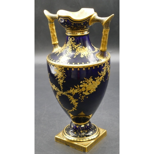 92 - A 19th Century Royal Crown Derby round bulbous thin necked 2-handled trumpet shaped vase on royal bl... 