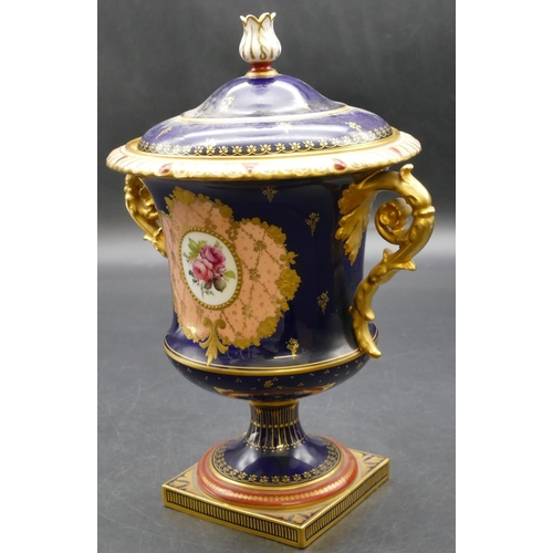 93 - An early 20th Century Royal Crown Derby round bulbous 2-handled urn shaped lidded pot on royal blue ... 