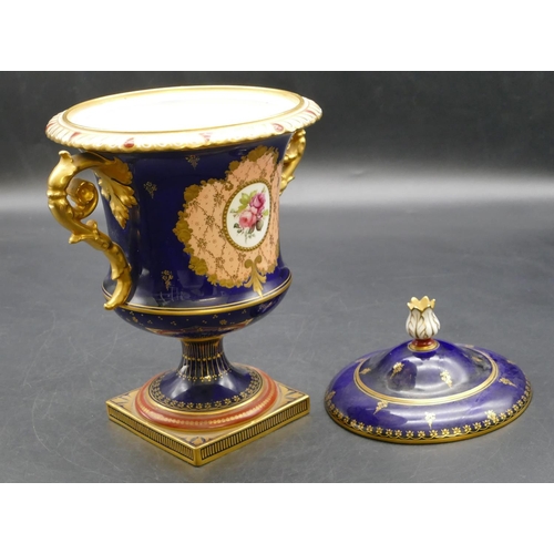 93 - An early 20th Century Royal Crown Derby round bulbous 2-handled urn shaped lidded pot on royal blue ... 