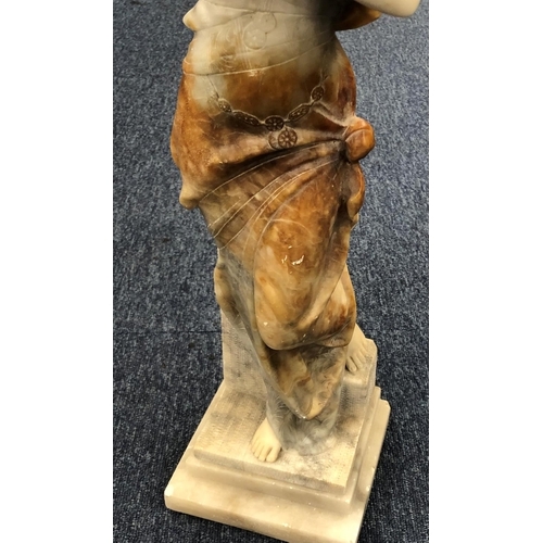 623 - A marble figure of a standing part naked lady on square base (unsigned), 60.5cm high