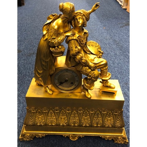 655 - A 19th Century ormolu French mantel clock with seated artist and standing lady to top, silvered dial... 