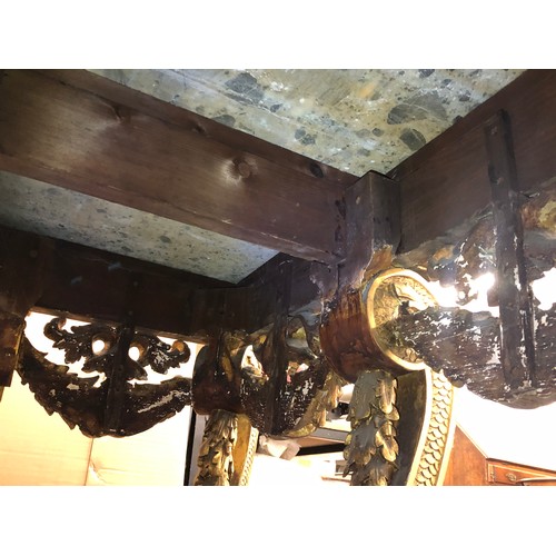 696 - An 18th Century and later carved gilt wood console table with green speckled marble top, carved frie... 