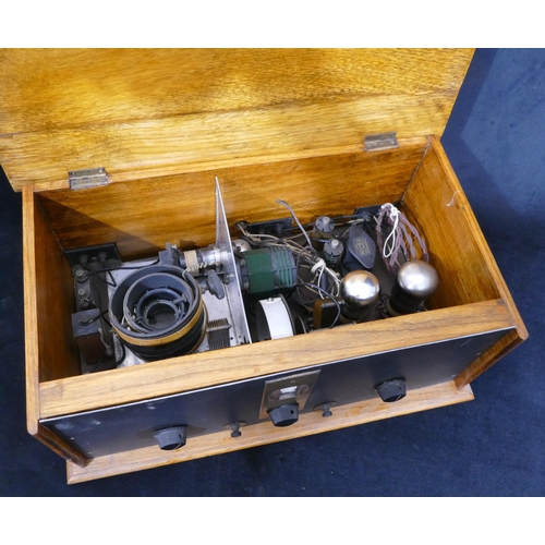An oak 1920's style rectangular shaped radio with hinged lid (interior ...