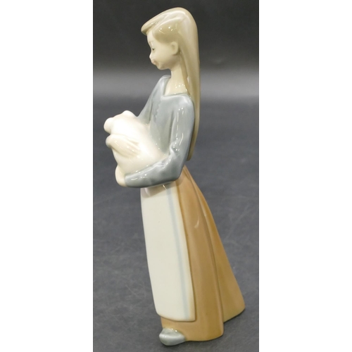 1 - A Lladro figure of a young standing lady holding a piglet, 17.5cm high