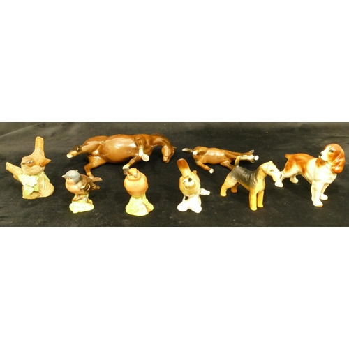 104 - A Beswick figure of a Spaniel, A Beswick figure of an Airedale, 4 china figures of birds (2 a/f) and... 