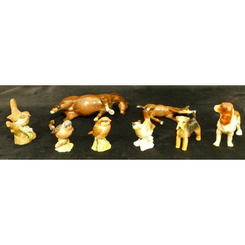 104 - A Beswick figure of a Spaniel, A Beswick figure of an Airedale, 4 china figures of birds (2 a/f) and... 