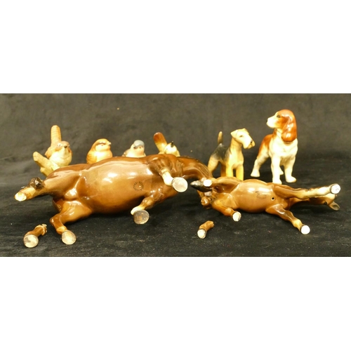 104 - A Beswick figure of a Spaniel, A Beswick figure of an Airedale, 4 china figures of birds (2 a/f) and... 