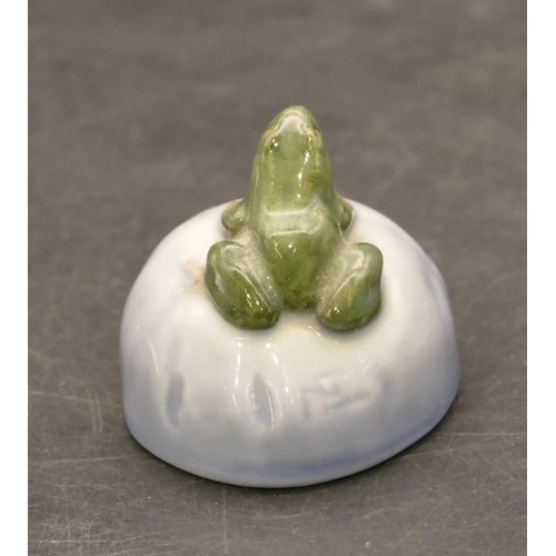 118 - A Royal Copenhagen small figure of a frog seated on a rock, no. 507, 4.2cm wide