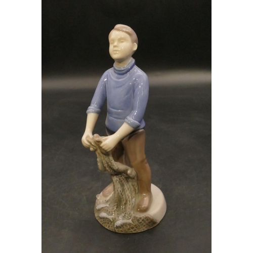 124 - B & G Copenhagen figure of a young gentleman bringing net full of fish, no. 2338, 19.5cm high