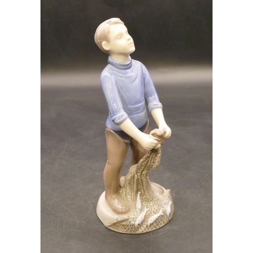 124 - B & G Copenhagen figure of a young gentleman bringing net full of fish, no. 2338, 19.5cm high