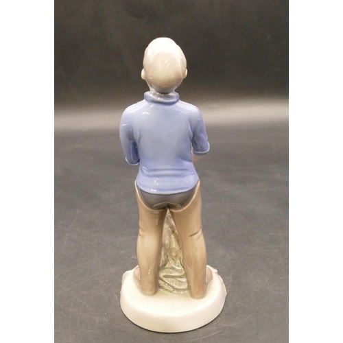 124 - B & G Copenhagen figure of a young gentleman bringing net full of fish, no. 2338, 19.5cm high