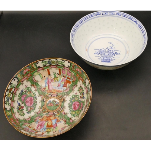 129 - A Cantonese round bowl on white and green ground with multicoloured figure, bird, floral and scroll ... 