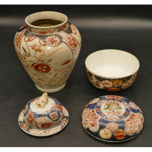 130 - A 19th Century Imari round bulbous shaped lidded pot on white, red and blue ground with floral, leaf... 