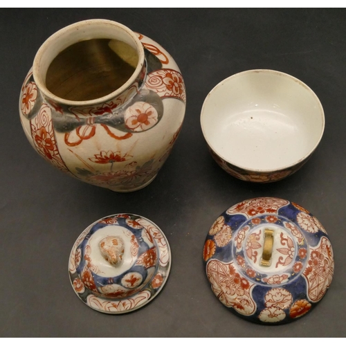 130 - A 19th Century Imari round bulbous shaped lidded pot on white, red and blue ground with floral, leaf... 