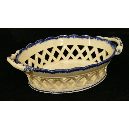 134 - A 19th Century Pearlware oval 2-handled basket on blue and white ground with pierced gallery, 21cm w... 