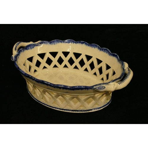 134 - A 19th Century Pearlware oval 2-handled basket on blue and white ground with pierced gallery, 21cm w... 