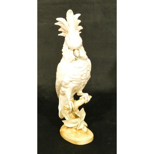 143 - A Royal Dux figure of a perched parrot, 41.5cm high (slight restoration to one feather)