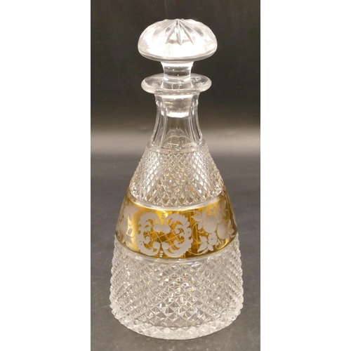 144 - A heavy cut glass round bulbous thin necked decanter with stopper with allover tooth cut decoration ... 