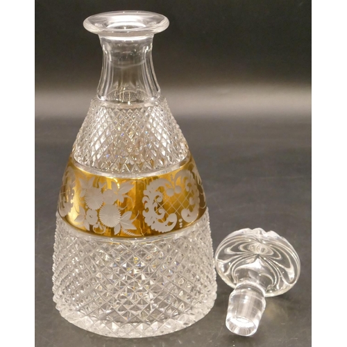 144 - A heavy cut glass round bulbous thin necked decanter with stopper with allover tooth cut decoration ... 