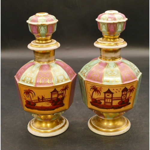 153 - A pair of Paris porcelain round bulbous thin necked scent bottles with stoppers on puce and turquois... 