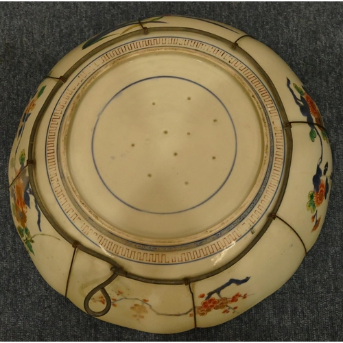 156 - A 19th Century Oriental round china scallop shaped charger on white and blue ground with multicolour... 