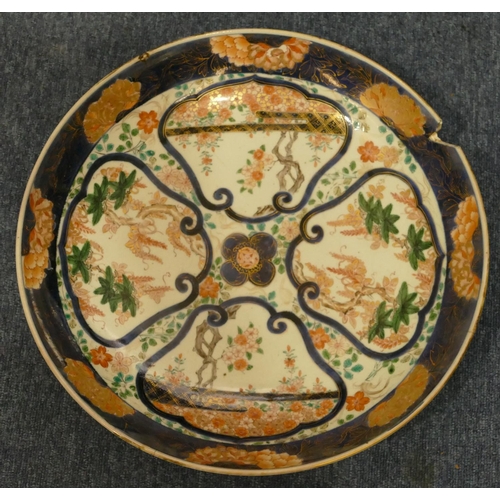 158 - A 19th Century Imari round charger on white and blue ground with multicoloured floral, leaf and gilt... 