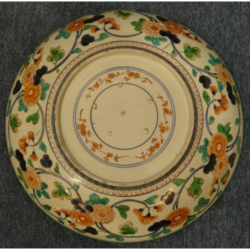 158 - A 19th Century Imari round charger on white and blue ground with multicoloured floral, leaf and gilt... 