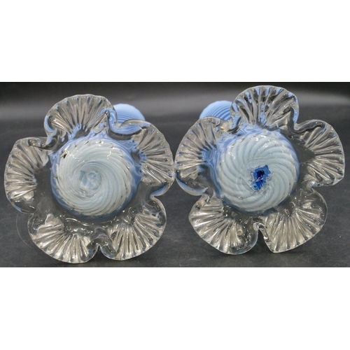 166 - A pair of pale blue opaline cylindrical vases with twist decoration on splayed leaf shaped bases, 25... 