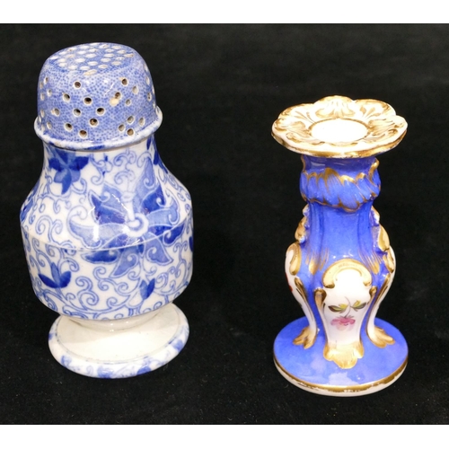 173 - A small china chamber candlestick on white and blue ground with multicoloured floral, leaf and gilt ... 