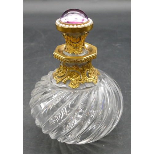 178 - A heavy cut glass and gilt metal mounted scent bottle with stopper, set with purple coloured stone a... 