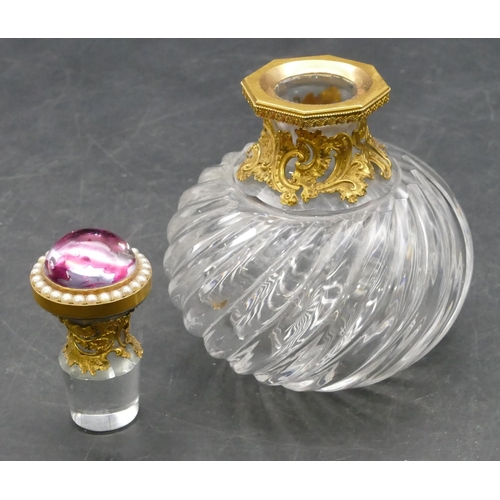 178 - A heavy cut glass and gilt metal mounted scent bottle with stopper, set with purple coloured stone a... 