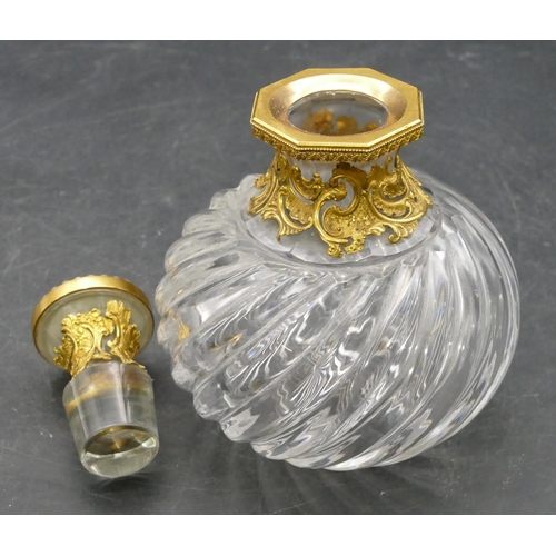 178 - A heavy cut glass and gilt metal mounted scent bottle with stopper, set with purple coloured stone a... 