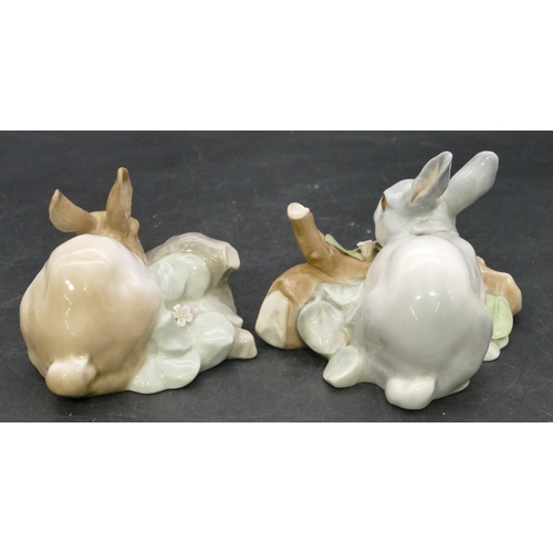 189 - A pair of Lladro figures of rabbits (some damage to encrusted flowers), 8.5cm high