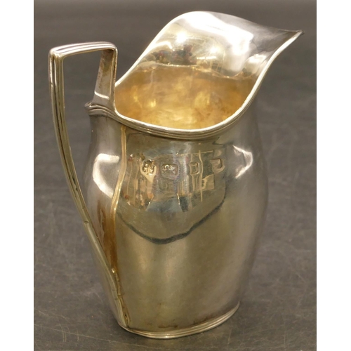 234 - An oval silver bulbous shaped cream jug with reeded rim, 10.5cm high, 3.3oz