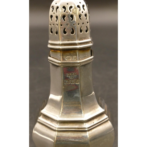 235 - A London silver bulbous sugar caster with chamfer decoration on sweeping base, 16.5cm high, maker's ... 