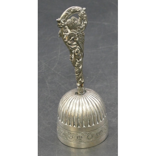 389 - A Continental silver coloured metal small hand bell with fluted bowl with bird motif to handle, 13m ... 