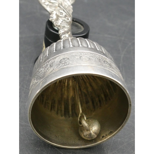 389 - A Continental silver coloured metal small hand bell with fluted bowl with bird motif to handle, 13m ... 