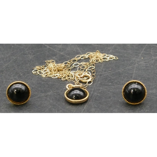 407 - A 9ct gold small black pendant with chain, also a pair of similar earrings, 1.6 grams gross,