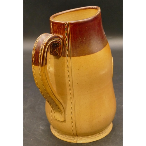 50 - A Doulton Lambeth stoneware jug in the form of a Royal Mail leather jug, inscribed GR either side of... 