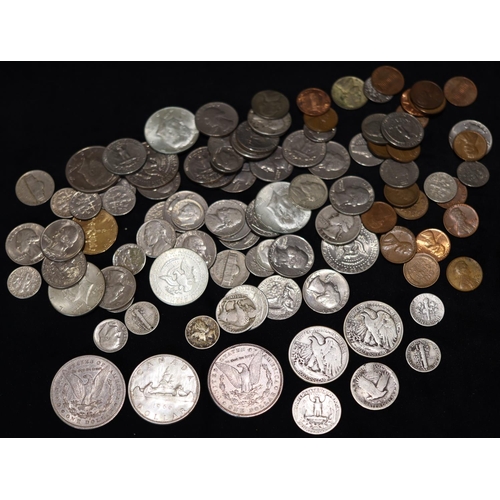 609 - 2 19th Century American silver Dollars, 1885 and 1878, a Canada Dollar, 1960, 2 Half Dollars, 1942 a... 