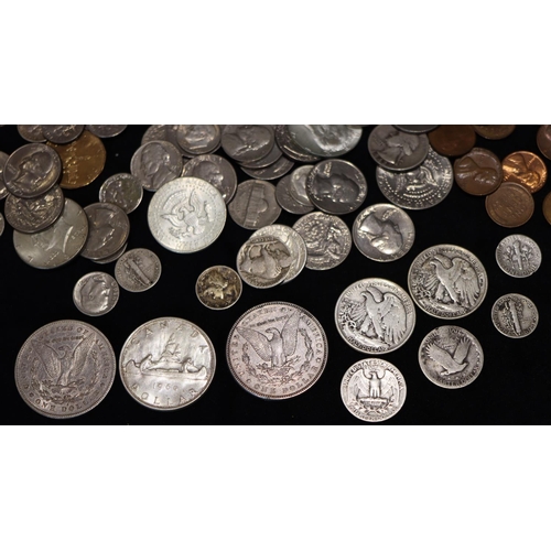 609 - 2 19th Century American silver Dollars, 1885 and 1878, a Canada Dollar, 1960, 2 Half Dollars, 1942 a... 