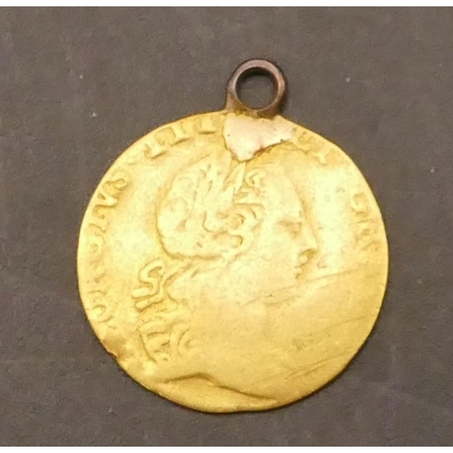 634 - A George III small gold coin converted to a pendant with silvered link to top, 1.8 grams