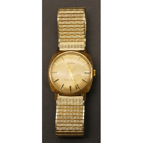 653 - A 9ct gold Tudor Gentlemen's square wristwatch with expanding plated strap bracelet, engraved inscri... 