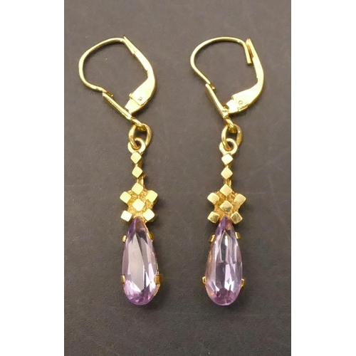 657 - A pair of 9ct gold amethyst drop earrings, 4cm long, 3.2 grams gross