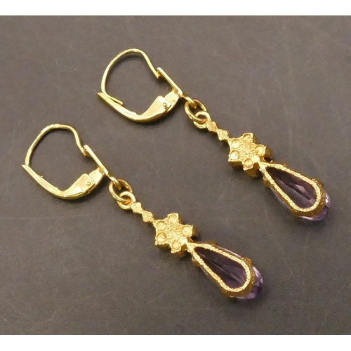 657 - A pair of 9ct gold amethyst drop earrings, 4cm long, 3.2 grams gross