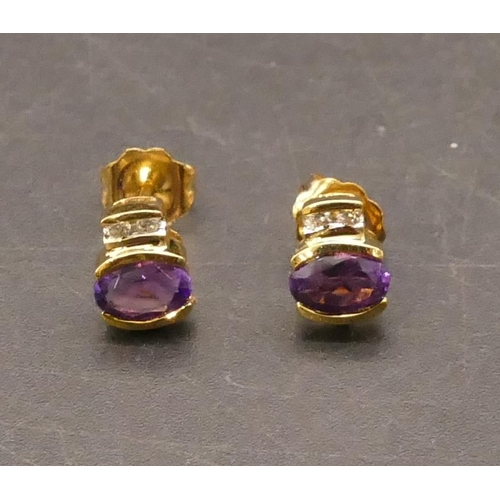 658 - A pair of 18ct gold stud earrings set with amethysts, each mounted with 2 small diamonds above, 1.6 ... 