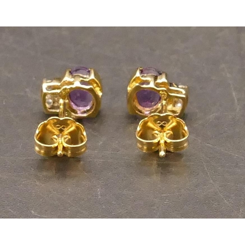 658 - A pair of 18ct gold stud earrings set with amethysts, each mounted with 2 small diamonds above, 1.6 ... 