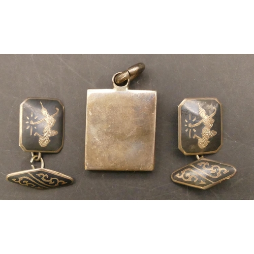 665 - A silver nugget pendant, a pair of gentlemen's silver Eastern cufflinks, 34.3 grams (3)