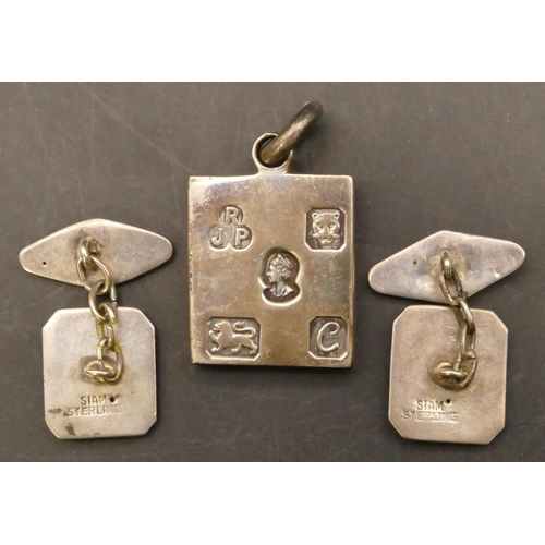 665 - A silver nugget pendant, a pair of gentlemen's silver Eastern cufflinks, 34.3 grams (3)